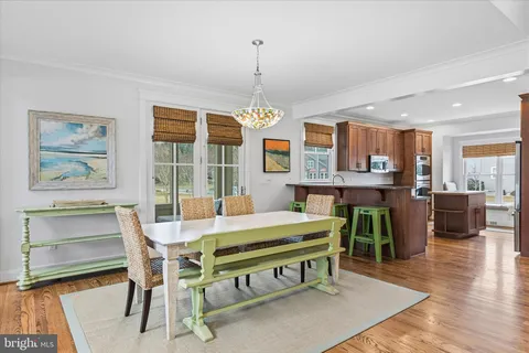 a kitchen with stainless steel appliances granite countertop a sink and a refrigerator