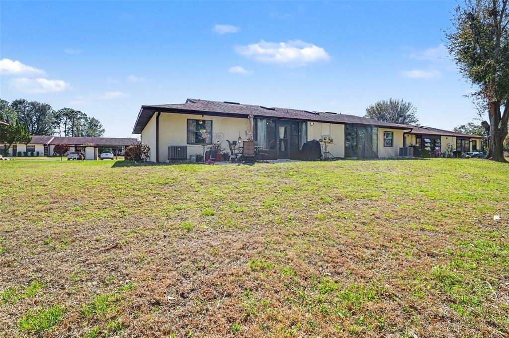 12435 Orangewood Circle Tavares, FL 32778 - Photo 29 of 30 a house view with a garden space