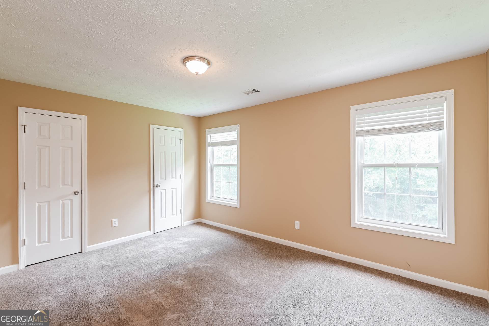1684 Summit Pl Way Loganville, GA 30052 - Photo 14 of 17 a view of an empty room with a window