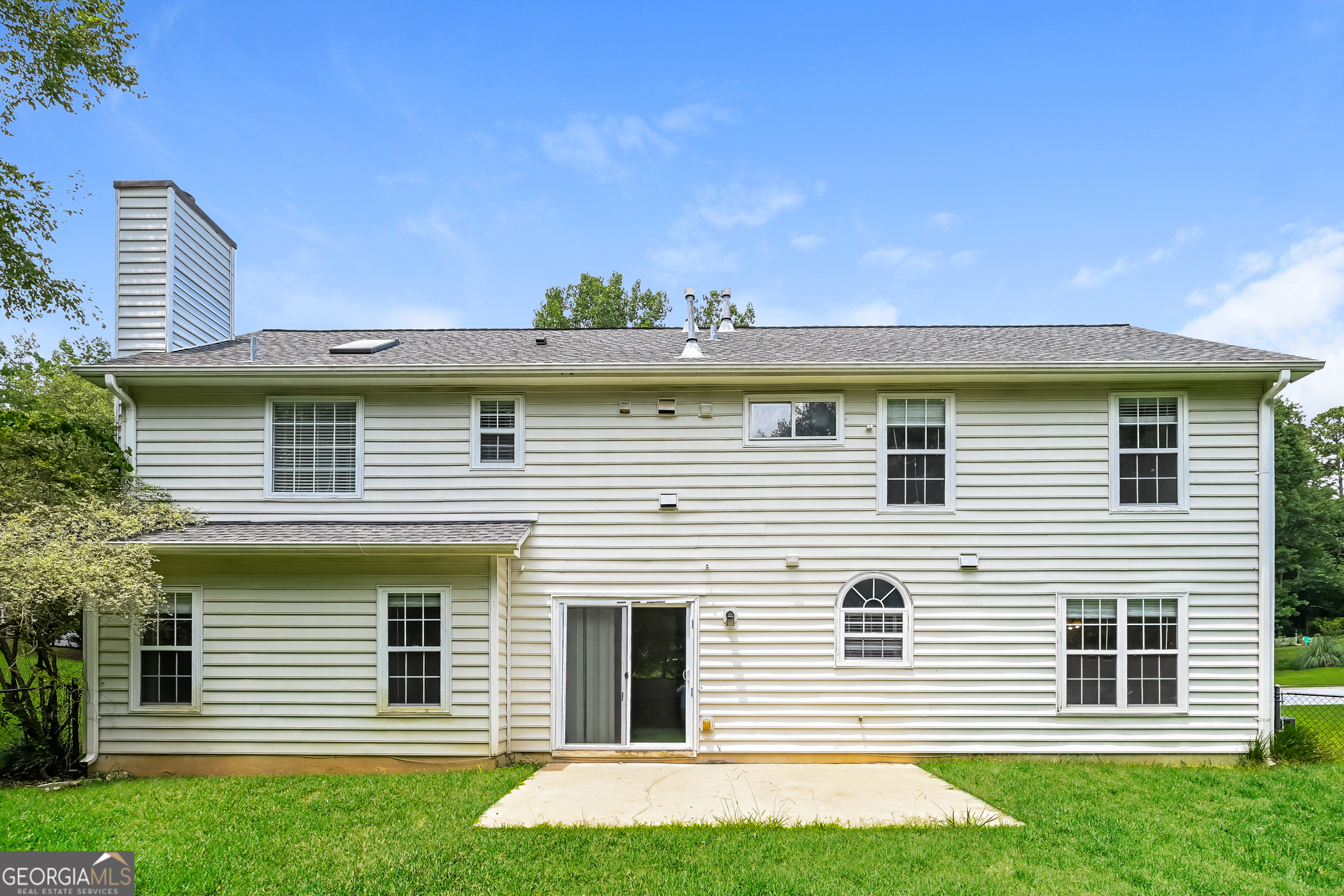 1684 Summit Pl Way Loganville, GA 30052 - Photo 16 of 17 a front view of a house with a yard and garage