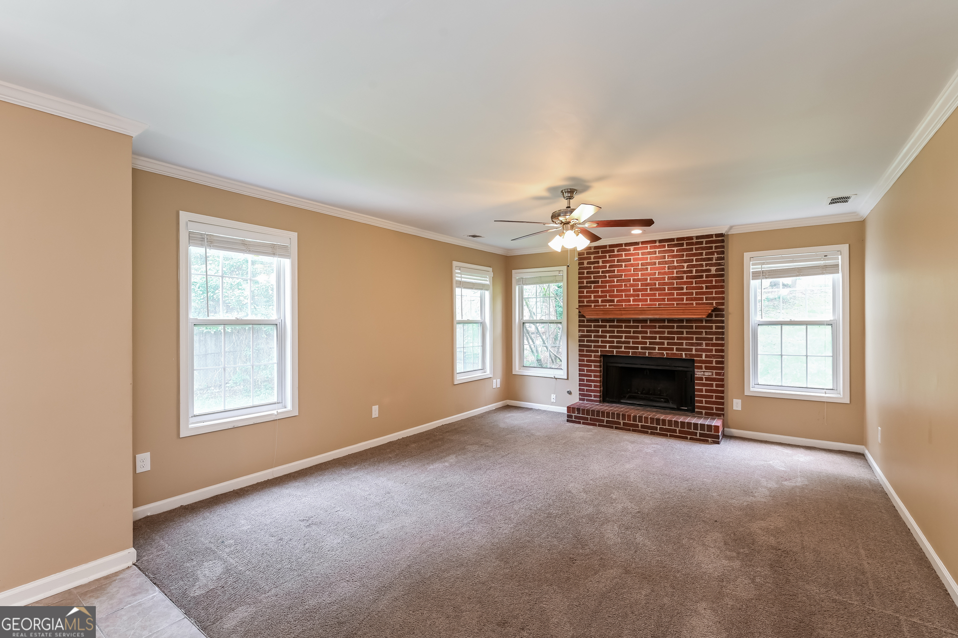 1684 Summit Pl Way Loganville, GA 30052 - Photo 4 of 17 a view of an empty room with window and fire place