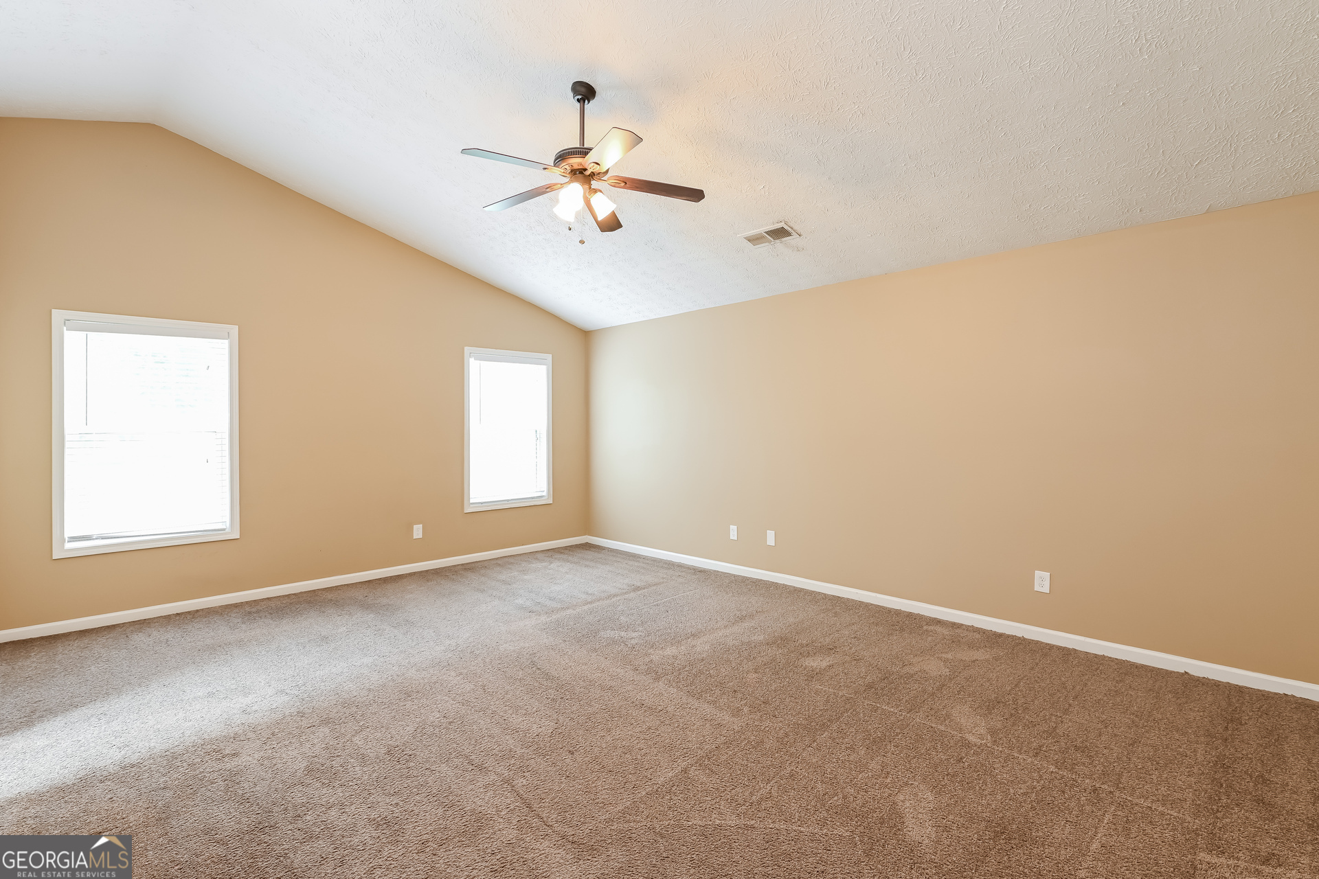 1684 Summit Pl Way Loganville, GA 30052 - Photo 10 of 17 a view of an empty room with a window