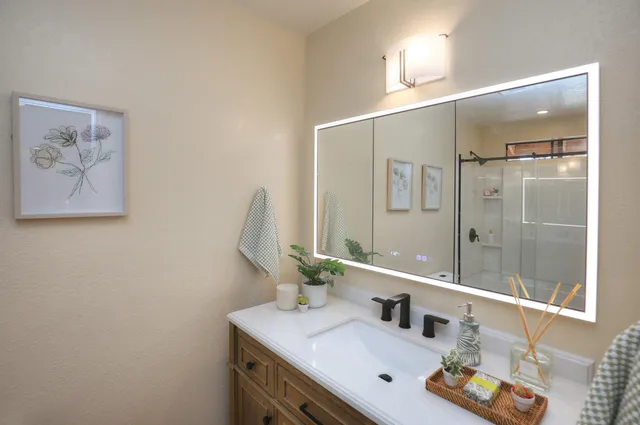 a bathroom with a sink and a mirror