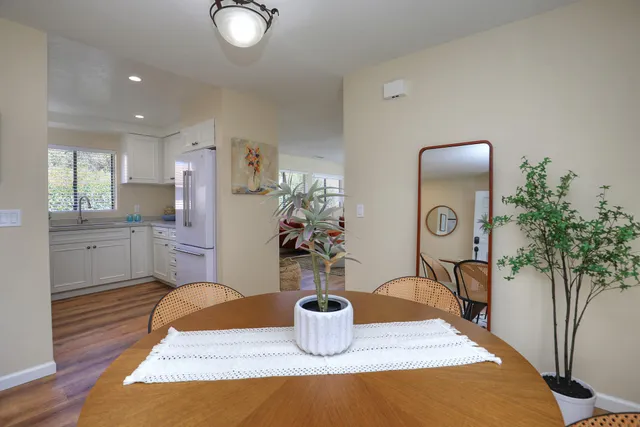 a kitchen with a table and chairs