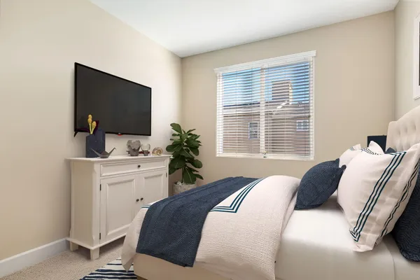 a bed room with furniture and a window