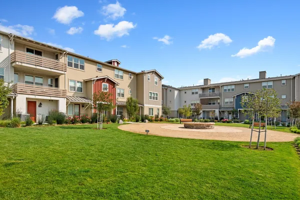 a front view of building with yard