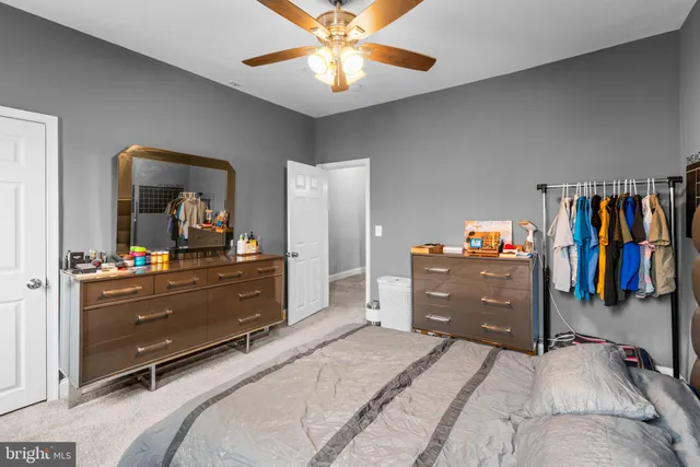 a bed room with a bed and a dresser