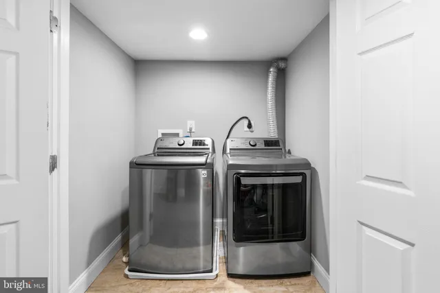 a utility room with washer and dryer