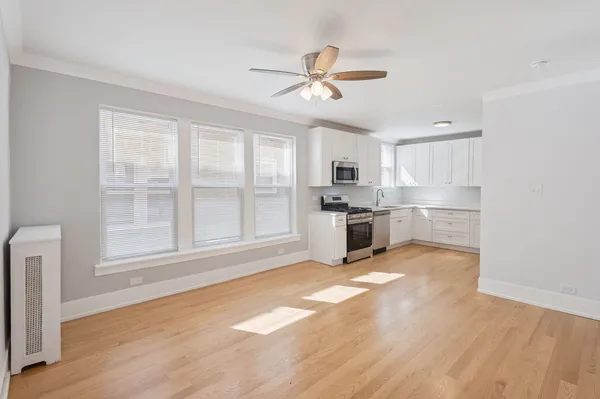 a view of a kitchen with a stove cabinets and wooden floor