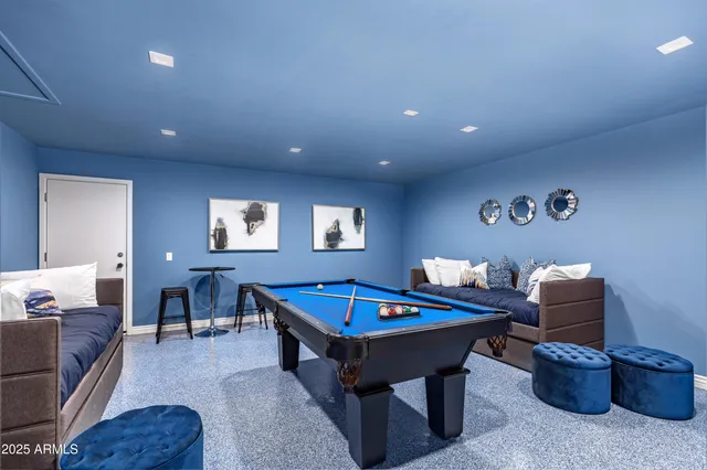 a living room with furniture a table and a window