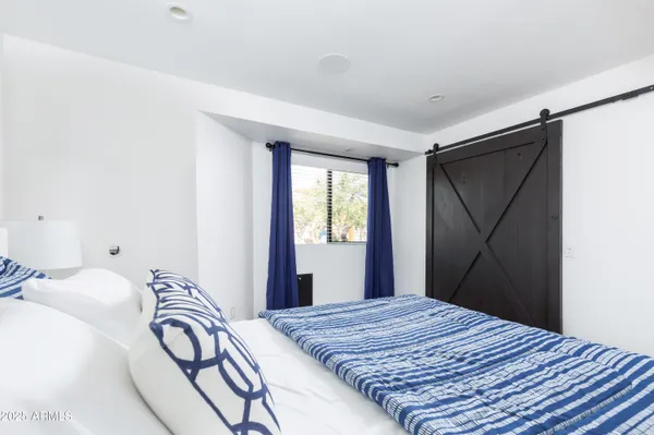 a view of a patio with couches and potted plants
