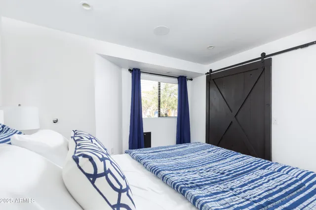 a view of a patio with couches and potted plants