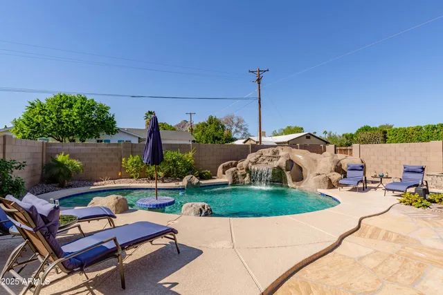 a patio with table and chairs