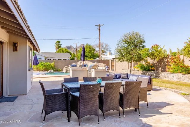 a view of a backyard with sitting area