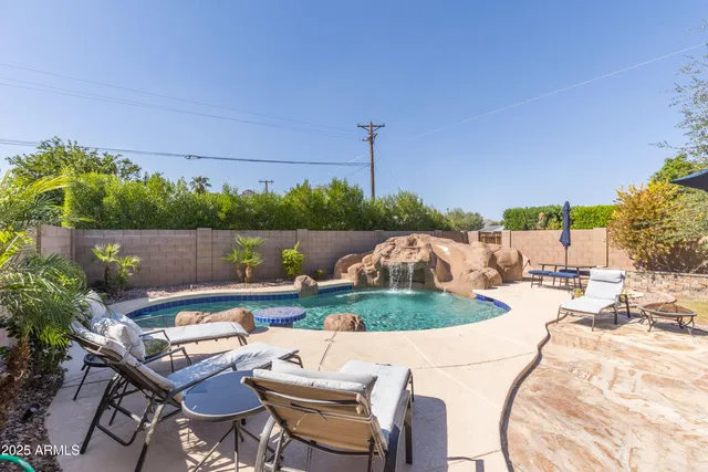 a view of a backyard with sitting area