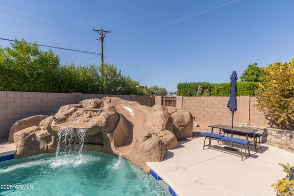 a view of a swimming pool with a patio