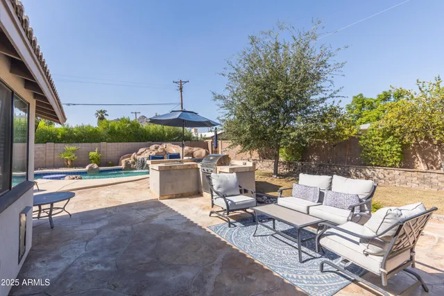 a patio with table and chairs
