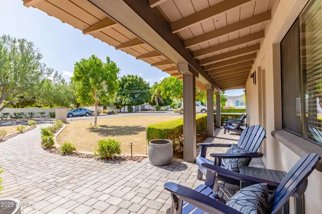 a view of swimming pool with outdoor seating and plants