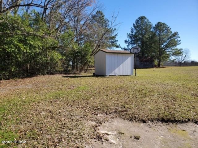 2154 Taylors Mill Road Fort Valley, GA 31030 - Photo 16 of 17 a view of a backyard with large trees