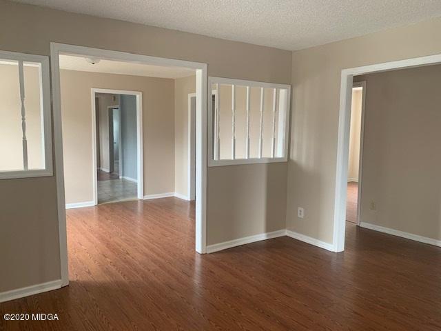 2154 Taylors Mill Road Fort Valley, GA 31030 - Photo 4 of 17 a view of livingroom with hardwood floor and hallway
