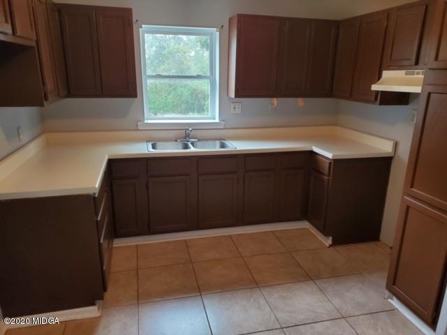 2154 Taylors Mill Road Fort Valley, GA 31030 - Photo 6 of 17 a kitchen with a cabinets and window