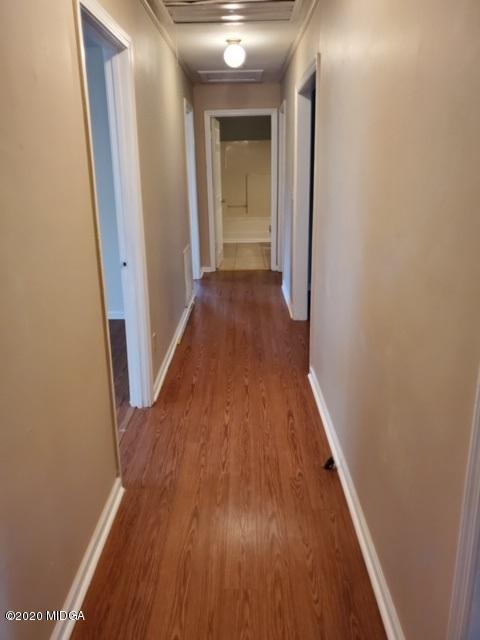 2154 Taylors Mill Road Fort Valley, GA 31030 - Photo 7 of 17 a view of a hallway with wooden floor