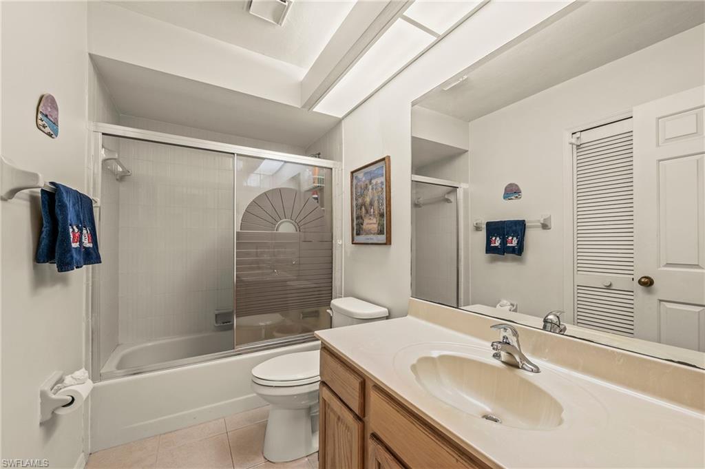156 Sabal Lake Drive Naples, FL 34104 - Photo 19 of 40 a bathroom with a sink toilet and shower