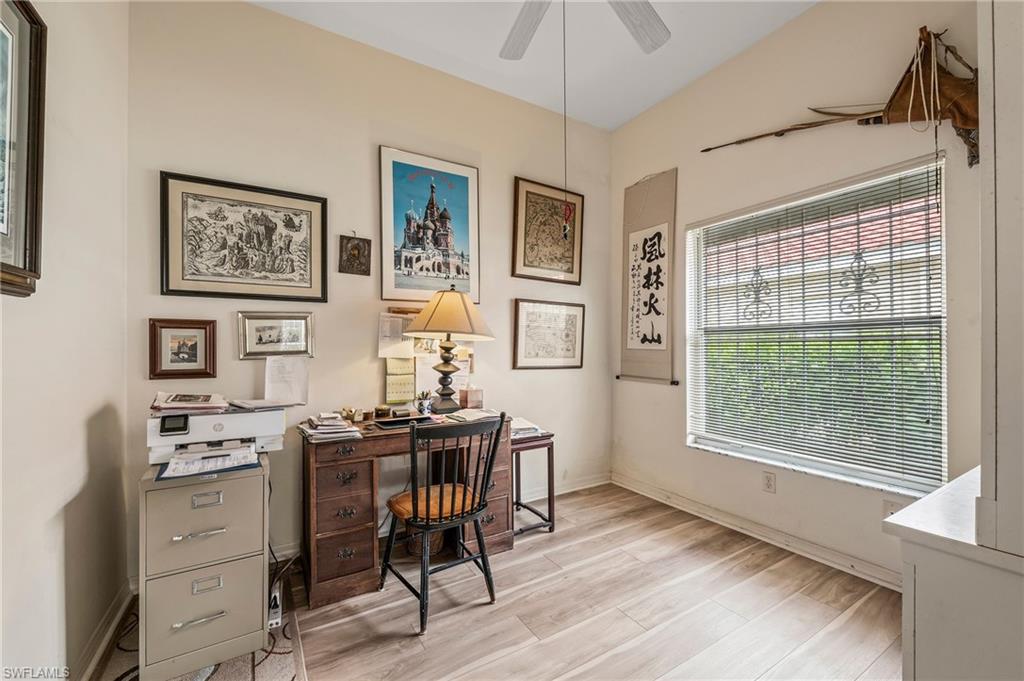 156 Sabal Lake Drive Naples, FL 34104 - Photo 20 of 40 a view of a workspace with furniture and a window