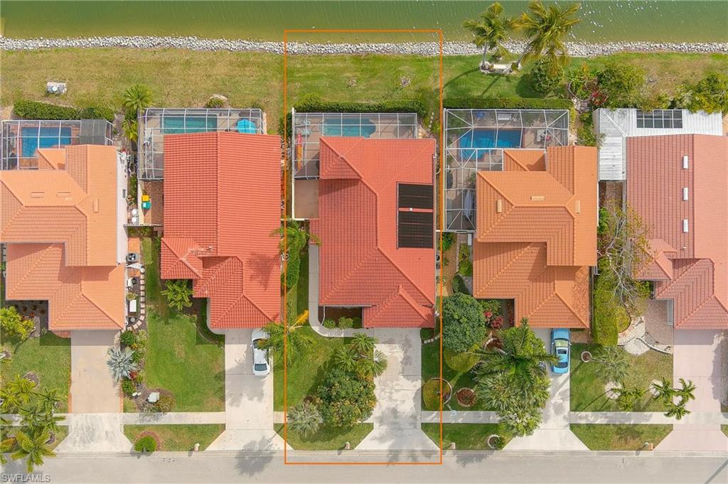 156 Sabal Lake Drive Naples, FL 34104 - Photo 27 of 40 an aerial view of residential houses with outdoor space and ocean view