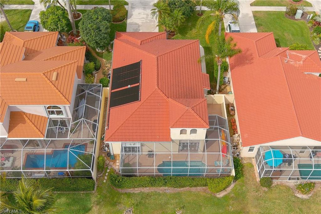 156 Sabal Lake Drive Naples, FL 34104 - Photo 4 of 40 an aerial view of residential houses with outdoor space and swimming pool