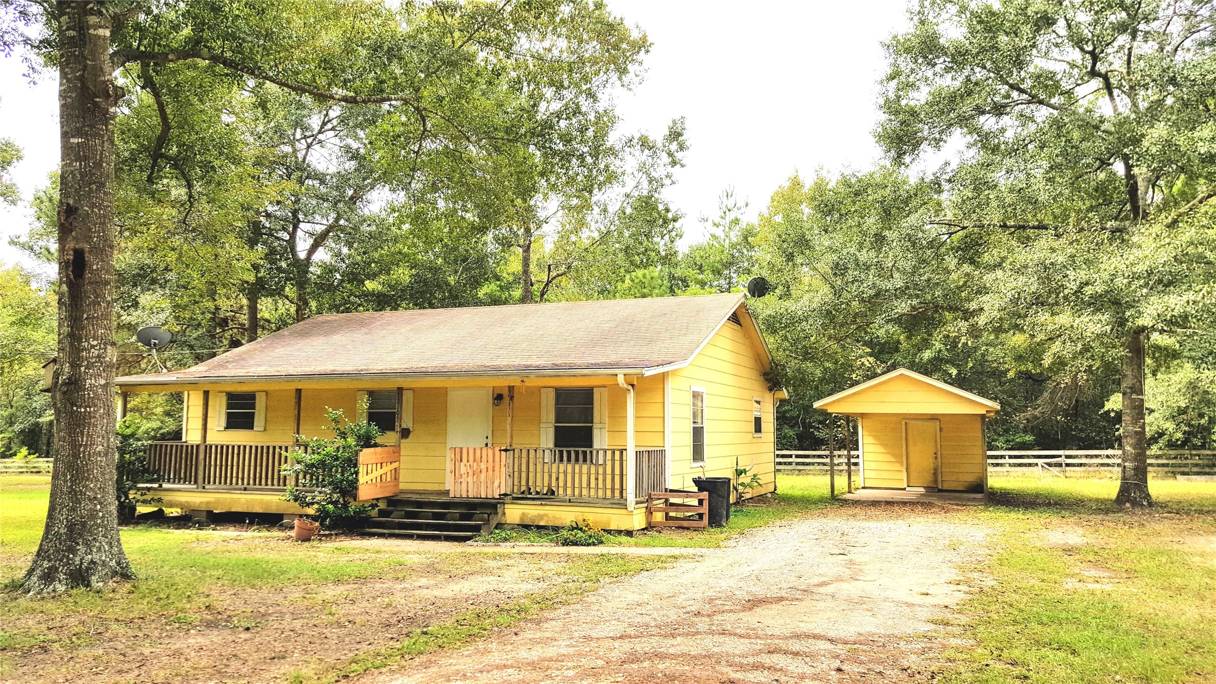12105 Old County Road Willis, TX 77378 - Photo 13 of 13 a view of a house with backyard and sitting area