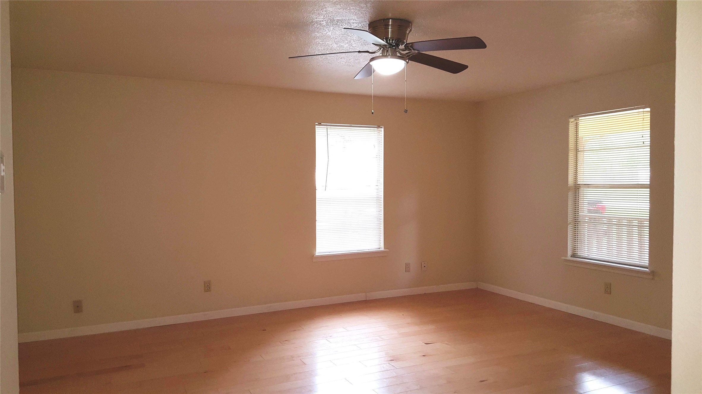 12105 Old County Road Willis, TX 77378 - Photo 4 of 13 an empty room with a window and a fan