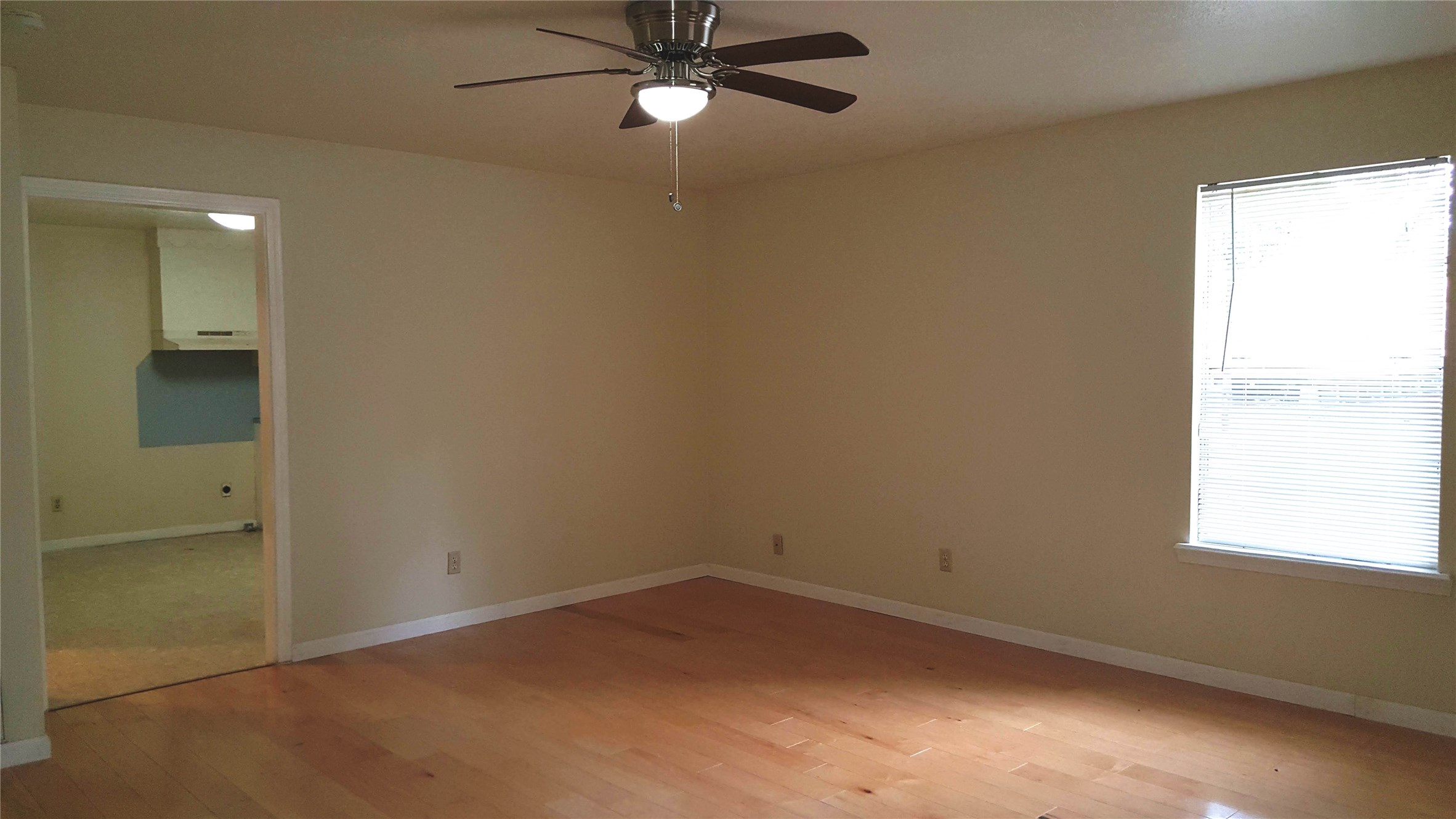 12105 Old County Road Willis, TX 77378 - Photo 5 of 13 an empty room with a window and a fan