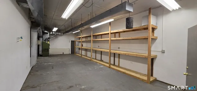a view of an empty room with racks on the wall