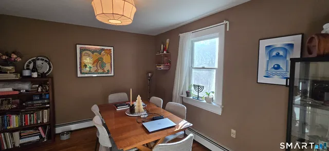 a dining room with furniture and window