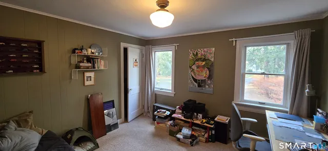 a room with furniture toys and a window