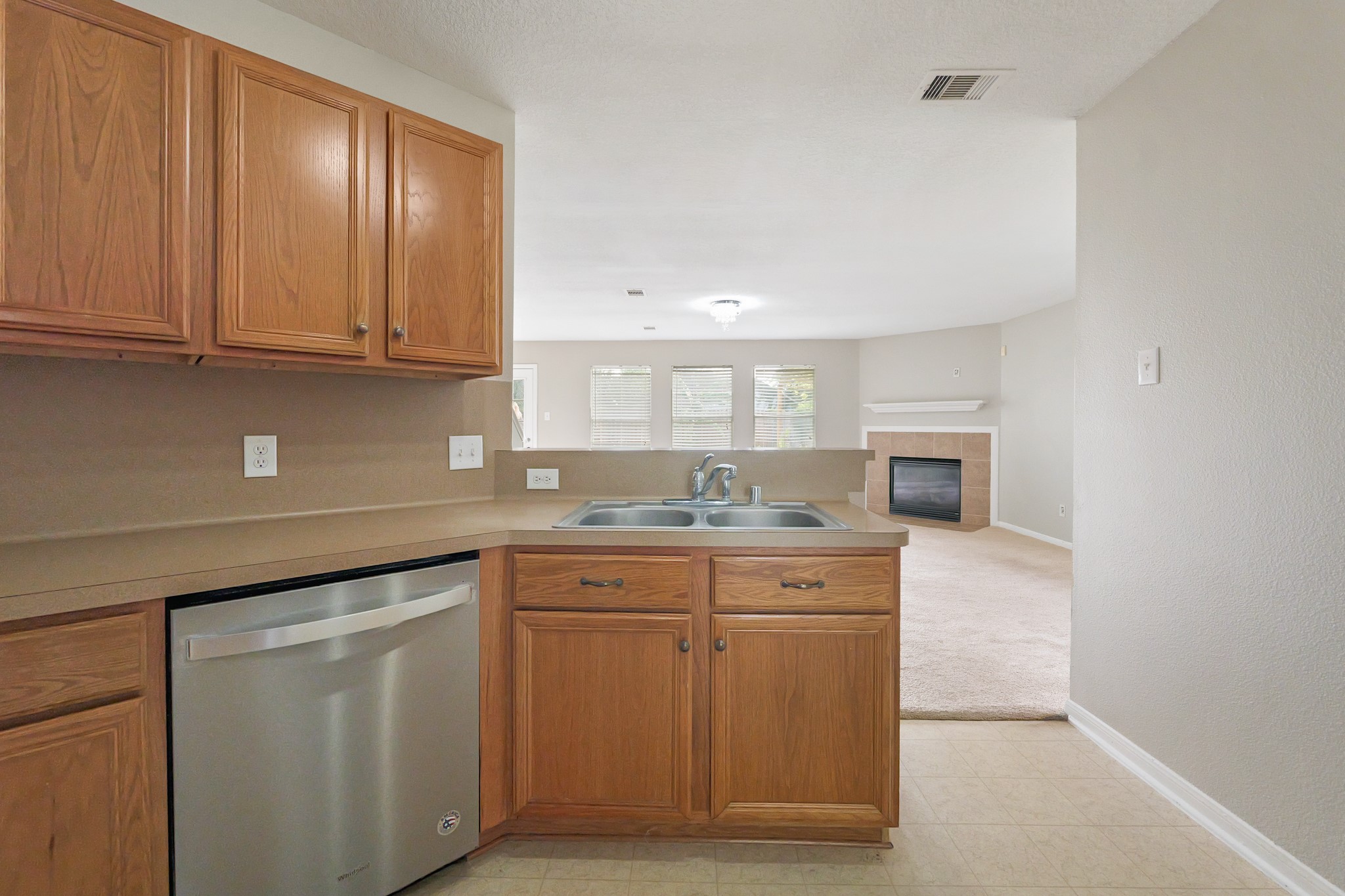 20410 Fall Foliage Drive Humble, TX 77338 - Photo 13 of 35 a kitchen with cabinets and window