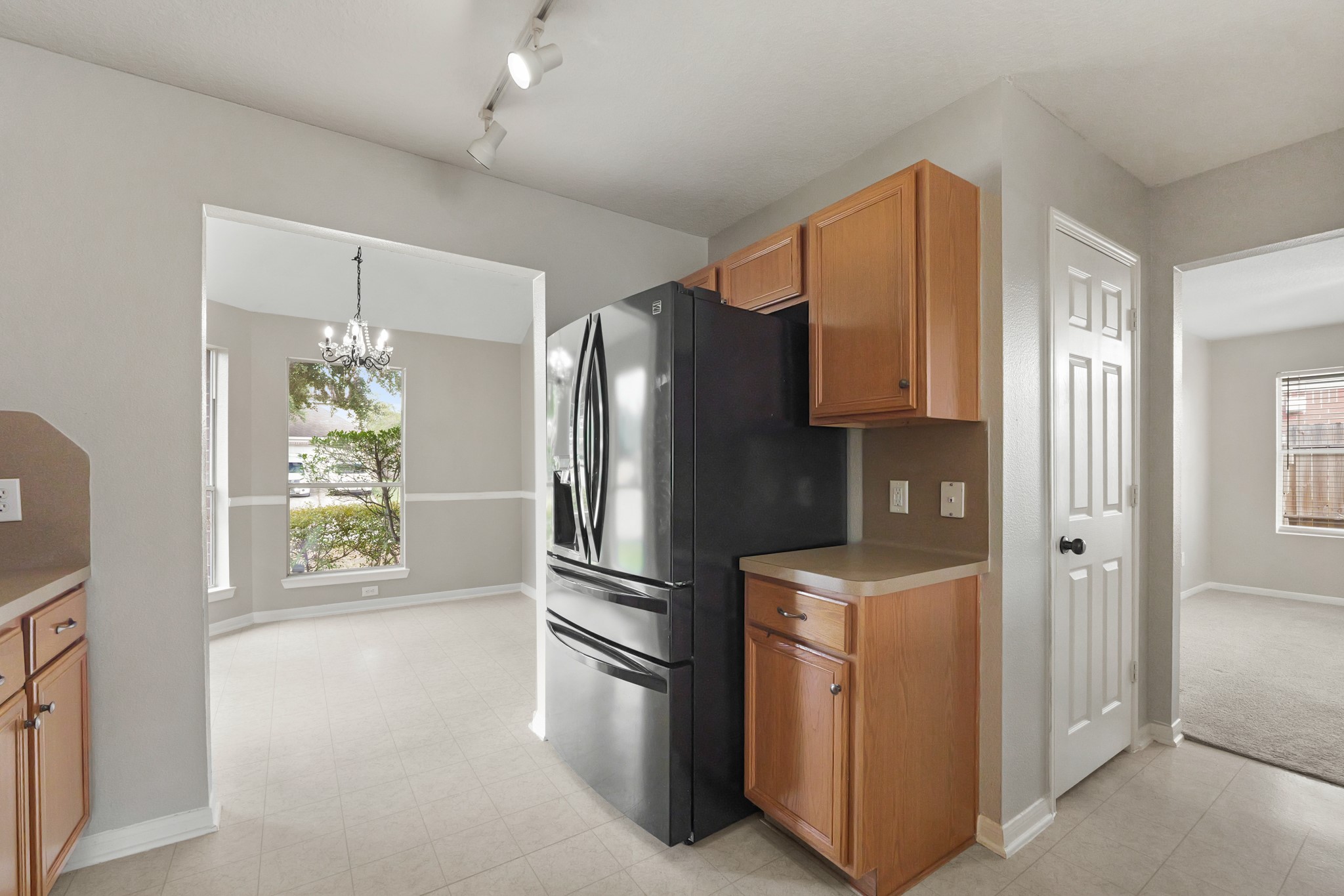 20410 Fall Foliage Drive Humble, TX 77338 - Photo 14 of 35 a kitchen with stainless steel appliances a refrigerator and a stove