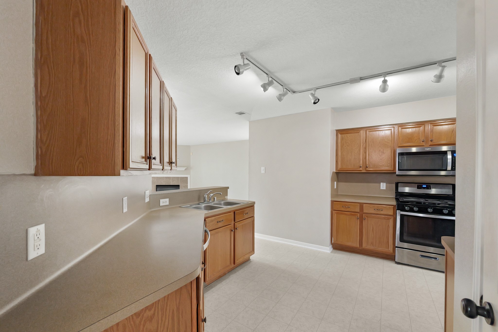 20410 Fall Foliage Drive Humble, TX 77338 - Photo 15 of 35 a kitchen with granite countertop a sink and stainless steel appliances