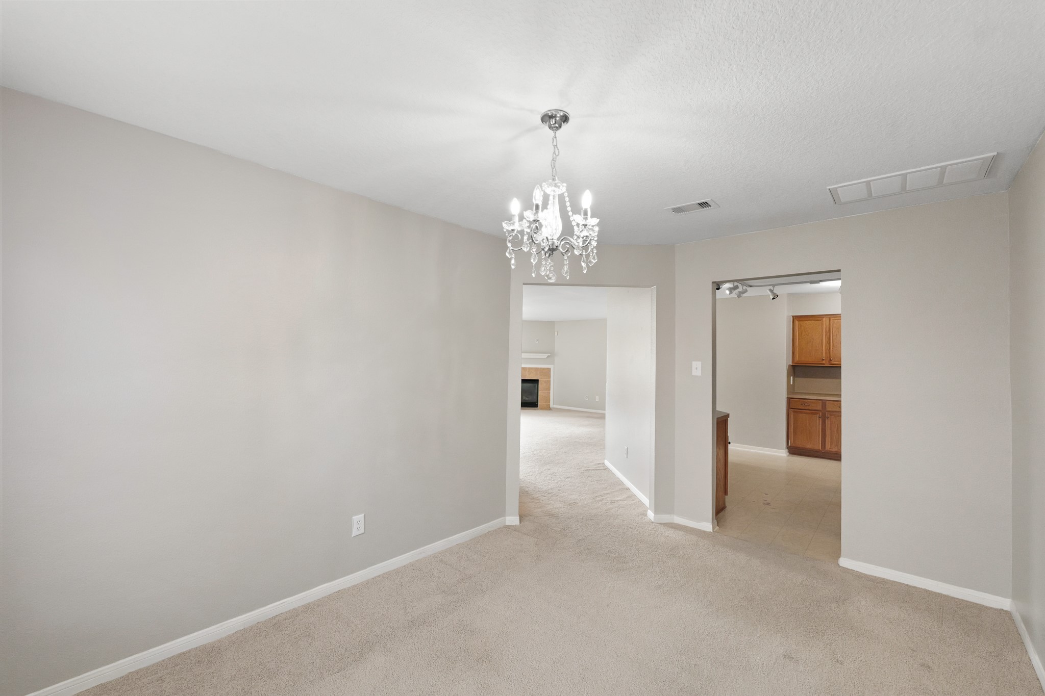 20410 Fall Foliage Drive Humble, TX 77338 - Photo 17 of 35 a view of a chandelier in big room and chandelier