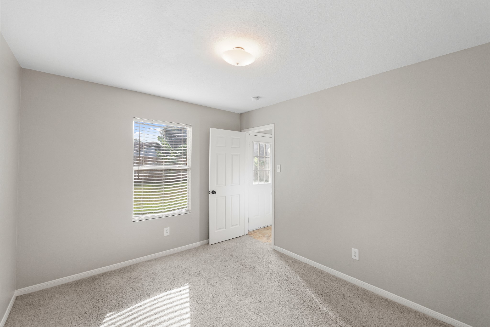 20410 Fall Foliage Drive Humble, TX 77338 - Photo 20 of 35 a view of an empty room with a window