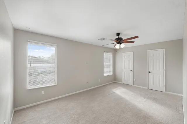 a bathroom with a bathtub and a toilet