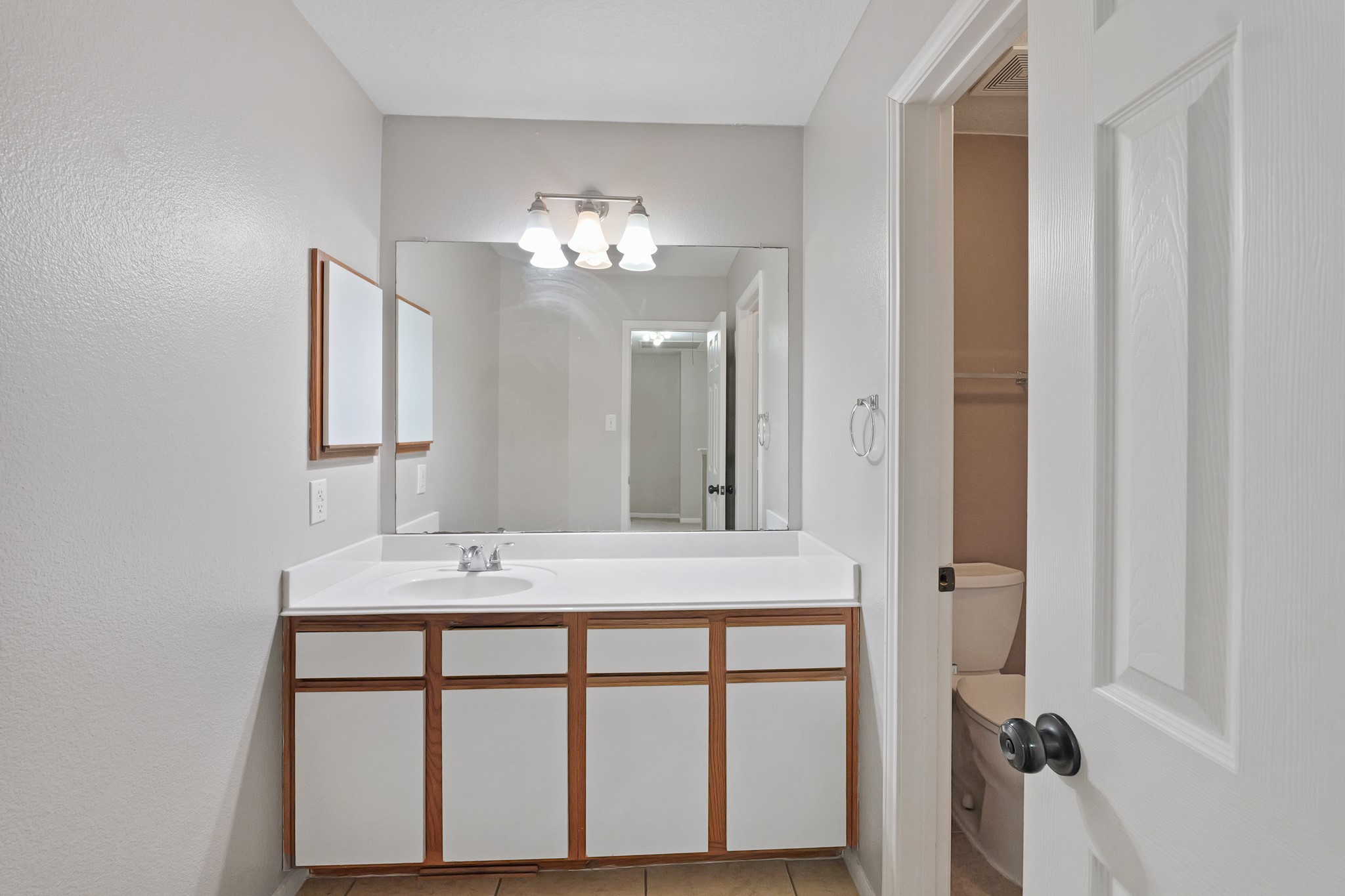20410 Fall Foliage Drive Humble, TX 77338 - Photo 23 of 35 a bathroom with a sink and a mirror