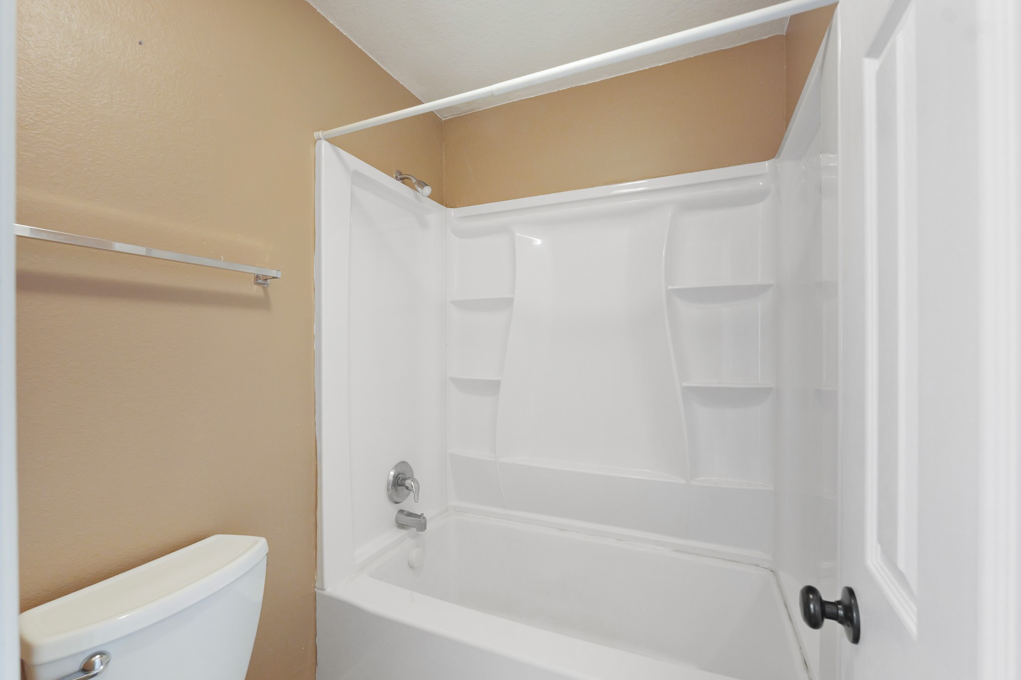 20410 Fall Foliage Drive Humble, TX 77338 - Photo 24 of 35 a bathroom with a bathtub and a toilet