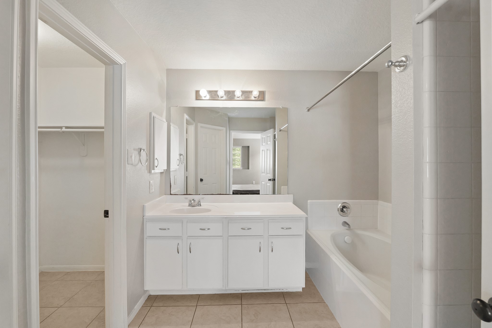 20410 Fall Foliage Drive Humble, TX 77338 - Photo 28 of 35 a bathroom with a sink and a bathtub
