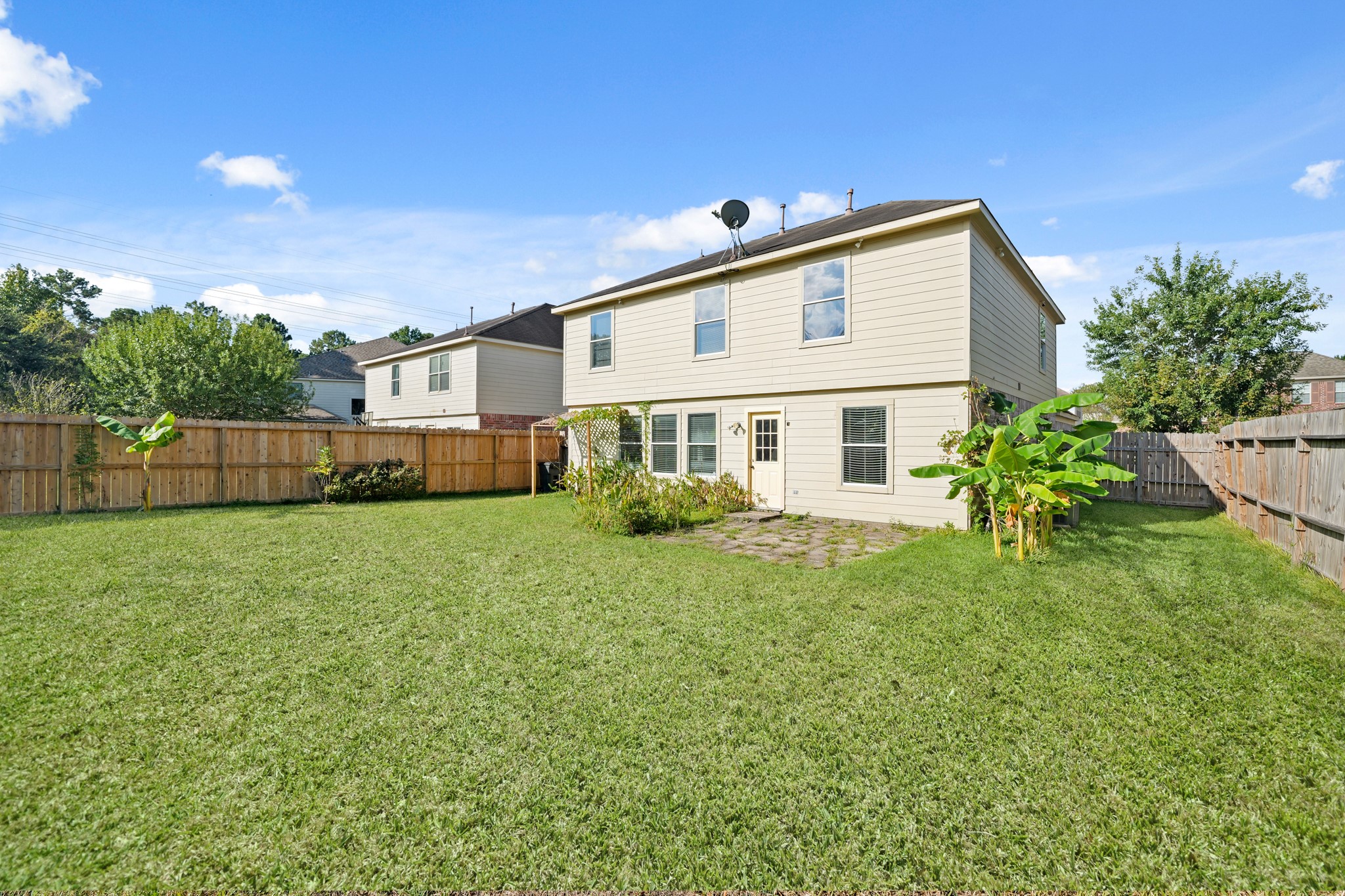 20410 Fall Foliage Drive Humble, TX 77338 - Photo 33 of 35 a front view of a house with a yard