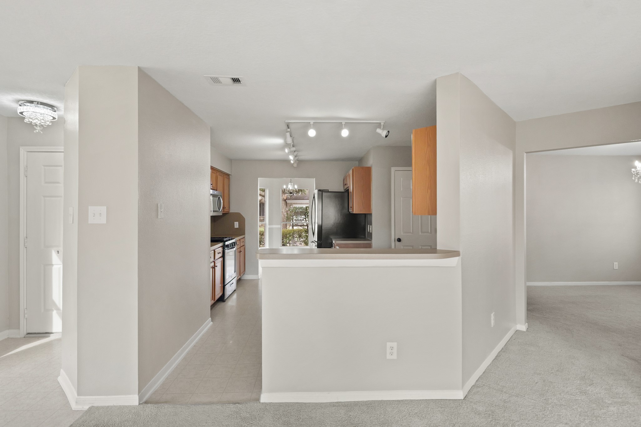 20410 Fall Foliage Drive Humble, TX 77338 - Photo 10 of 35 a view of living room with stainless steel appliances with kitchen countertop