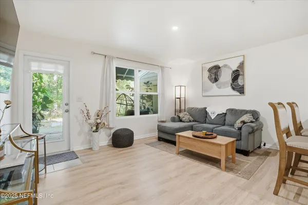 a living room with furniture and a large window