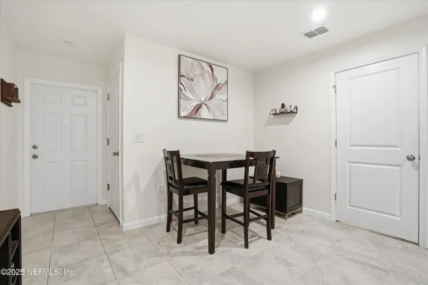 a view of a dining room with furniture