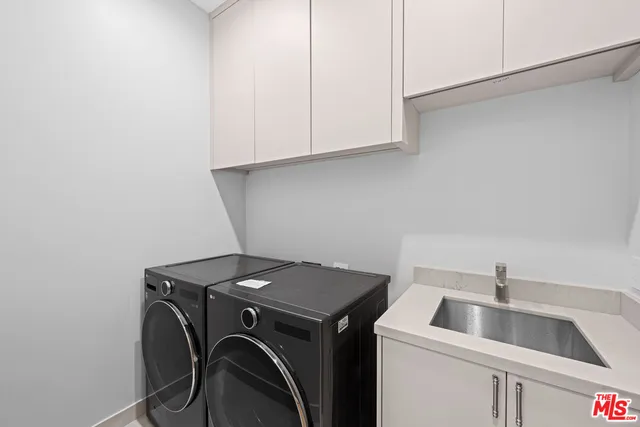 a bedroom with a large bed and a large window